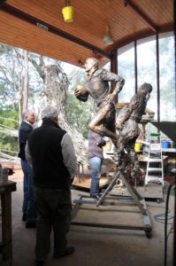 Basil Sellers and SCG Chairman Rodney Cavalier inspecting the cast bronze sculpture of Reg Gasnier
