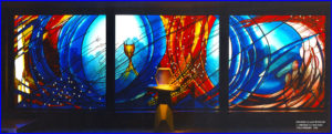 This stained glass window alludes to baptism, Eurcharist, community and reconciliation painted and etched glass, 11m x 3m, St. Bernadettes Castle Hill