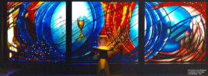 This stained glass window alludes to baptism, Eurcharist, community and reconciliation painted and etched glass, 11m x 3m, St. Bernadettes Castle Hill