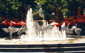 "Dancing Brolgas" Spiral dancing water feature, spirals vertically in dance mode, figures cast stainless steel, Cockle Bay, Sydney