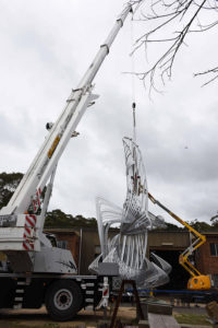 "Uniting A Nation" being craned to ground