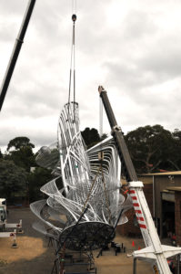 "Uniting A Nation" being craned to ground