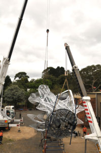 "Uniting A Nation" being craned to ground